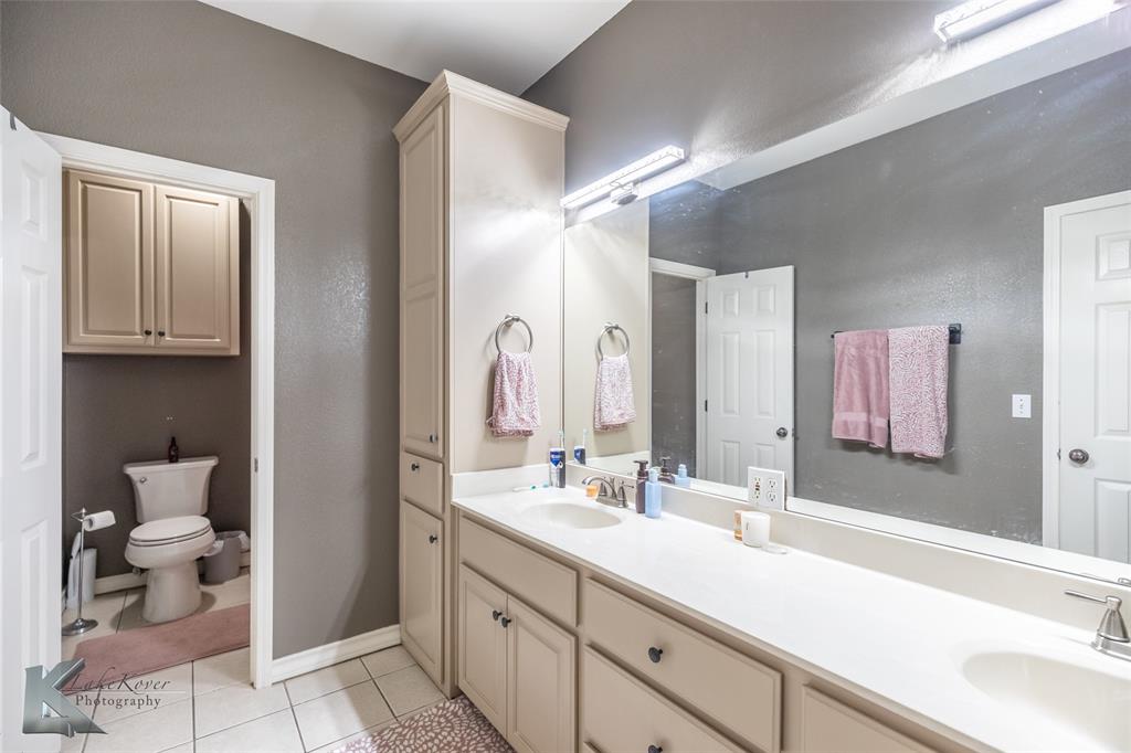 1834 Marathon Court Abilene, TX 79601 - Photo 21 of 39 a bathroom with a sink and a mirror