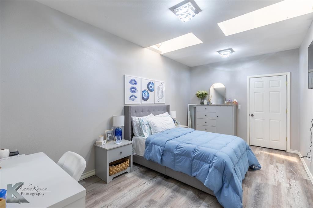 1834 Marathon Court Abilene, TX 79601 - Photo 22 of 39 a bedroom with a bed and cabinets