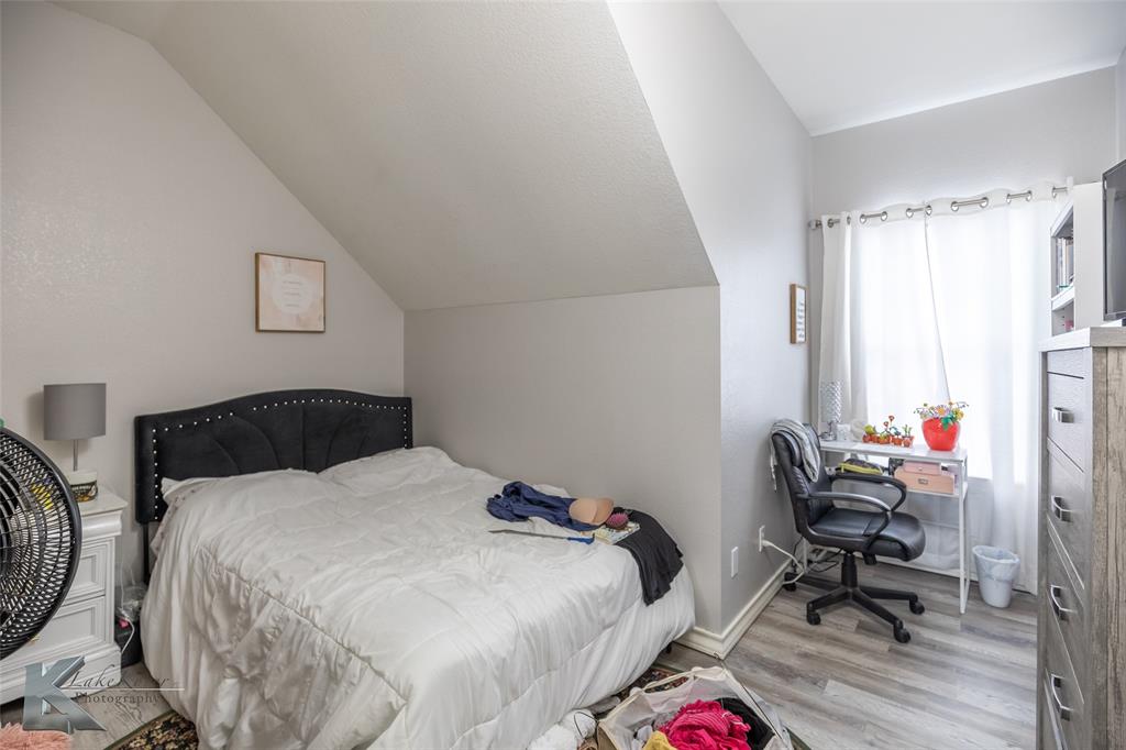 1834 Marathon Court Abilene, TX 79601 - Photo 23 of 39 a bedroom with a bed and a window