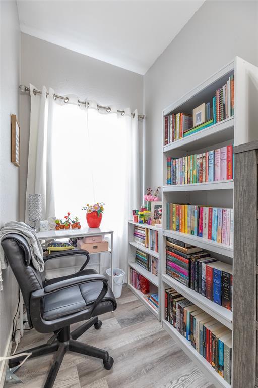 1834 Marathon Court Abilene, TX 79601 - Photo 27 of 39 a living room with furniture and a book shelf