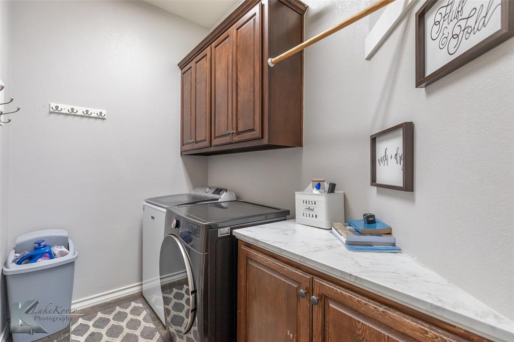 1834 Marathon Court Abilene, TX 79601 - Photo 29 of 39 a utility room with sink dryer and washer
