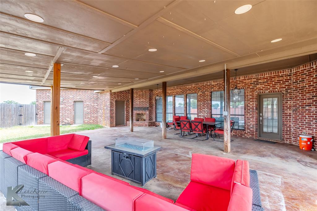 1834 Marathon Court Abilene, TX 79601 - Photo 31 of 39 a living room with furniture a floor to ceiling window and couch