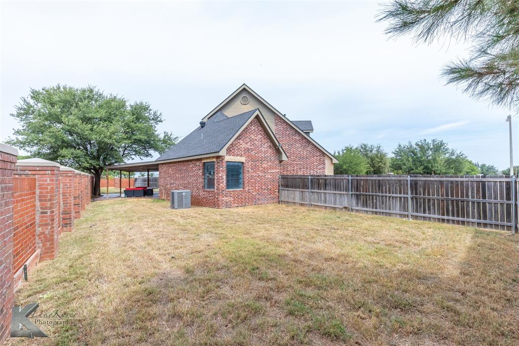 1834 Marathon Court Abilene, TX 79601 - Photo 33 of 39 a view of a house with a yard and palm trees