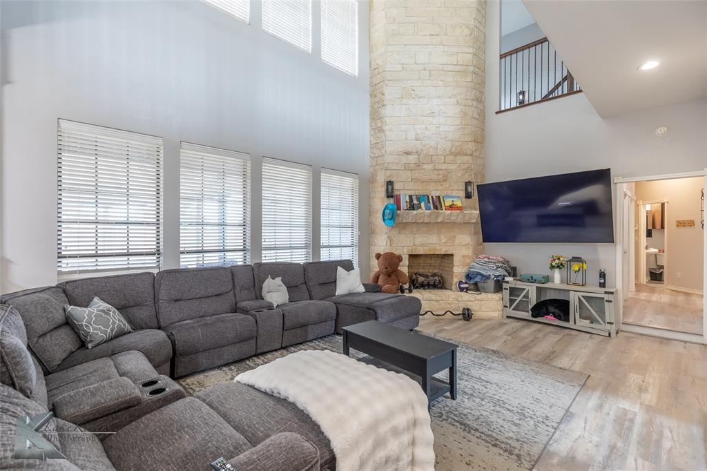 1834 Marathon Court Abilene, TX 79601 - Photo 7 of 39 a living room with furniture and a flat screen tv