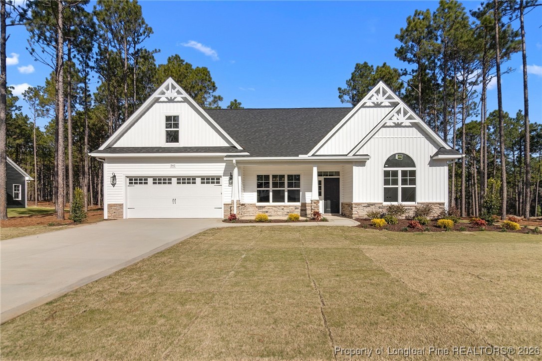 940 Rhum Drive Fayetteville, NC 28311 - Photo 2 of 45 a view of a white house with a large windows and palm trees
