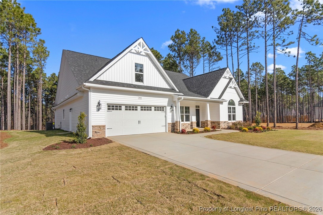 940 Rhum Drive Fayetteville, NC 28311 - Photo 3 of 45 a view of a house with a yard and garage