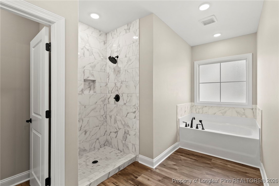 940 Rhum Drive Fayetteville, NC 28311 - Photo 34 of 45 a bathroom with a bathtub and shower