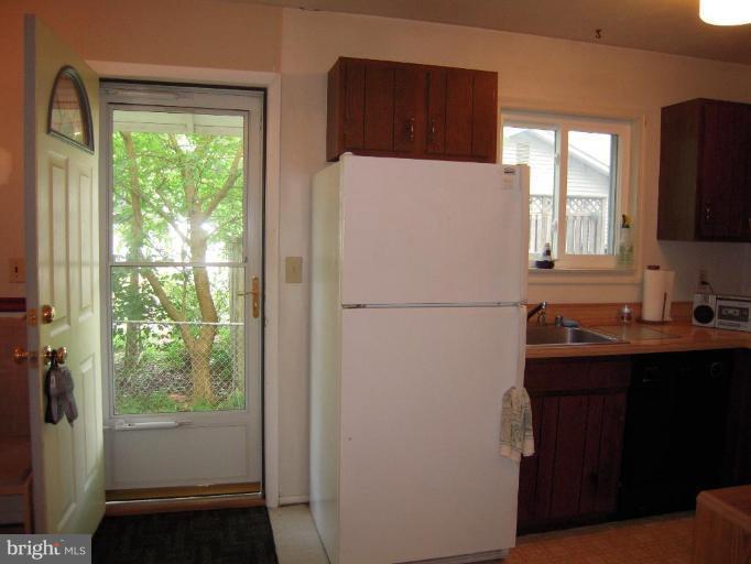 313 Londontown Road Edgewater, MD 21037 - Photo 19 of 25 a white refrigerator freezer sitting in a kitchen
