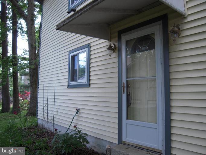 313 Londontown Road Edgewater, MD 21037 - Photo 25 of 25 a view of house with a door and wooden walls