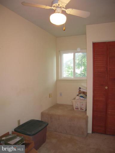 313 Londontown Road Edgewater, MD 21037 - Photo 8 of 25 a bathroom with a toilet and a chair