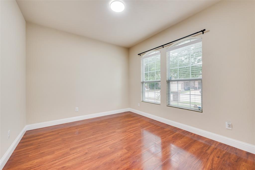 4521 Indian Paint Way Denton, TX 76208 - Photo 14 of 36 a view of an empty room with wooden floor and a window