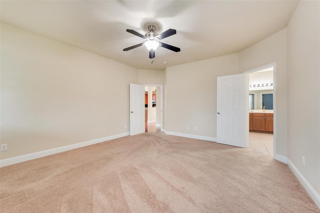 4521 Indian Paint Way Denton, TX 76208 - Photo 19 of 36 an empty room with closet and windows