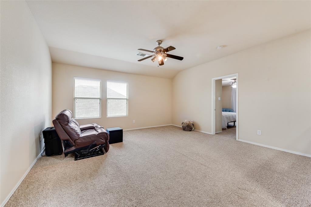 4521 Indian Paint Way Denton, TX 76208 - Photo 24 of 36 an empty room with windows and ceiling fan