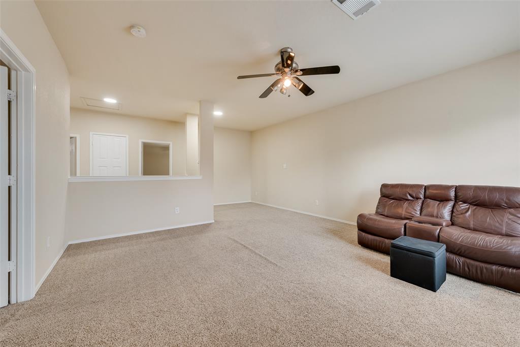 4521 Indian Paint Way Denton, TX 76208 - Photo 25 of 36 a living room with furniture and a ceiling fan