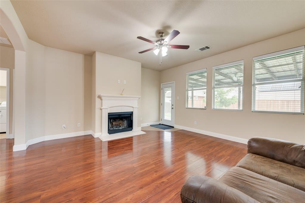 4521 Indian Paint Way Denton, TX 76208 - Photo 4 of 36 a living room with furniture and a fireplace