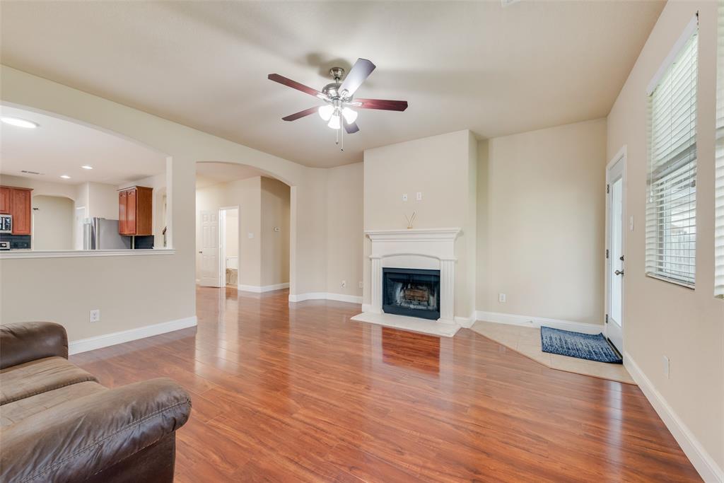 4521 Indian Paint Way Denton, TX 76208 - Photo 5 of 36 a living room with furniture and a fireplace