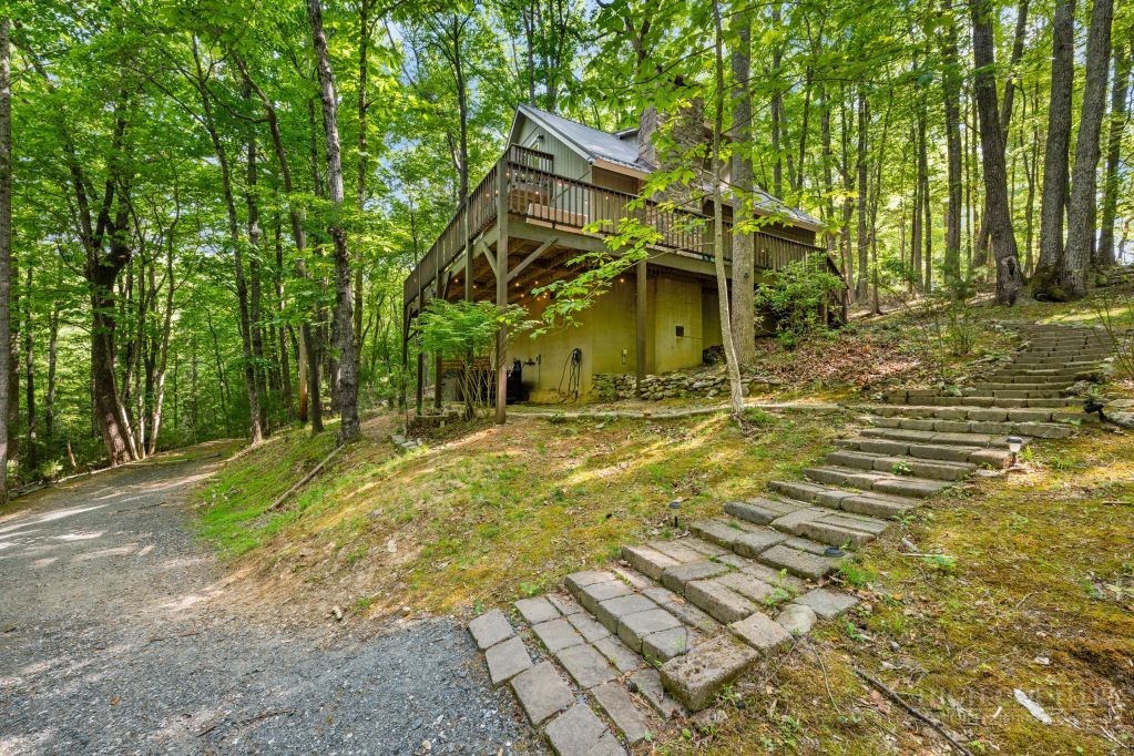 216 Saddle Lane Deep Gap, NC 28618 - Photo 31 of 44 a view of a house with basketball court