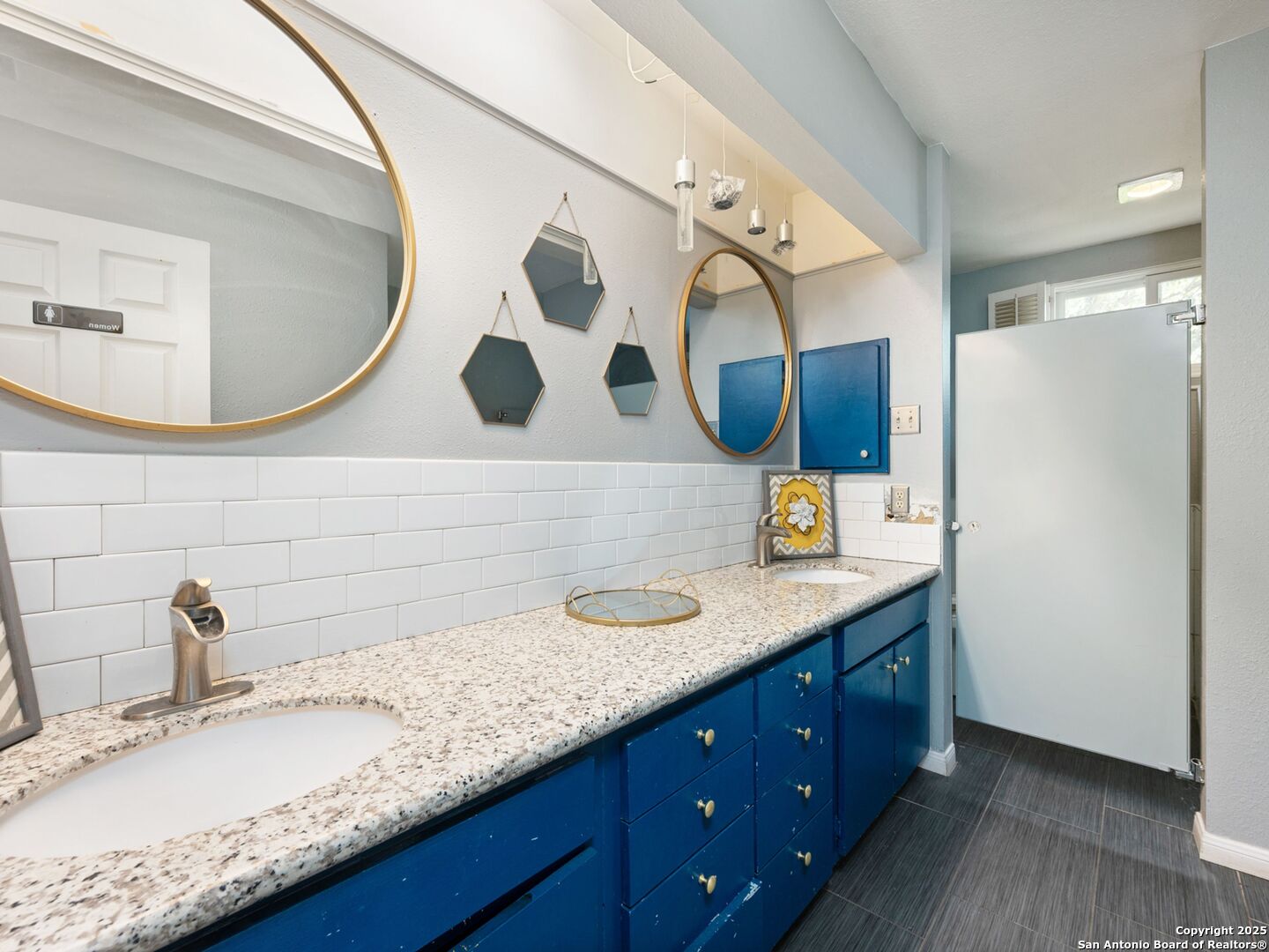 6472 Whitby Road San Antonio, TX 78240 - Photo 14 of 23 a bathroom with a granite countertop sink mirror and vanity