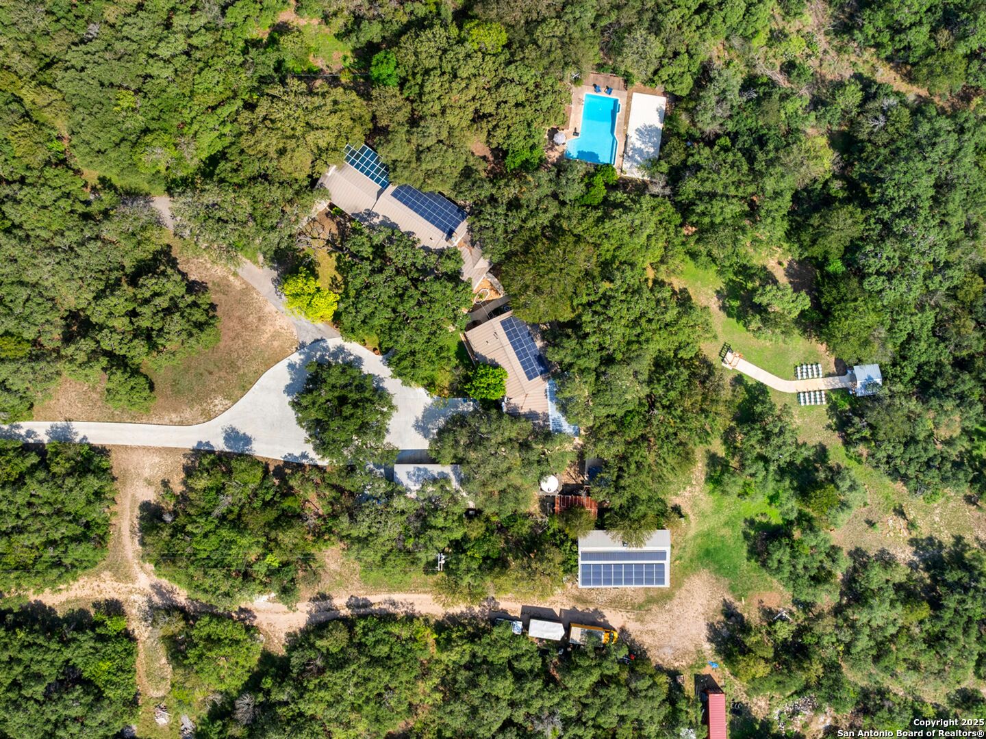 6472 Whitby Road San Antonio, TX 78240 - Photo 22 of 23 an aerial view of residential house with outdoor space and trees around