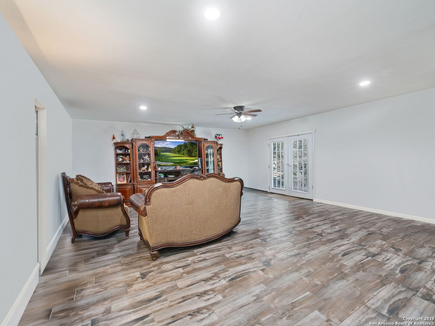 6472 Whitby Road San Antonio, TX 78240 - Photo 3 of 23 a living room with furniture and a wooden floor