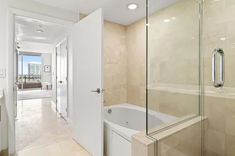 a bathroom with a bathtub and a shower