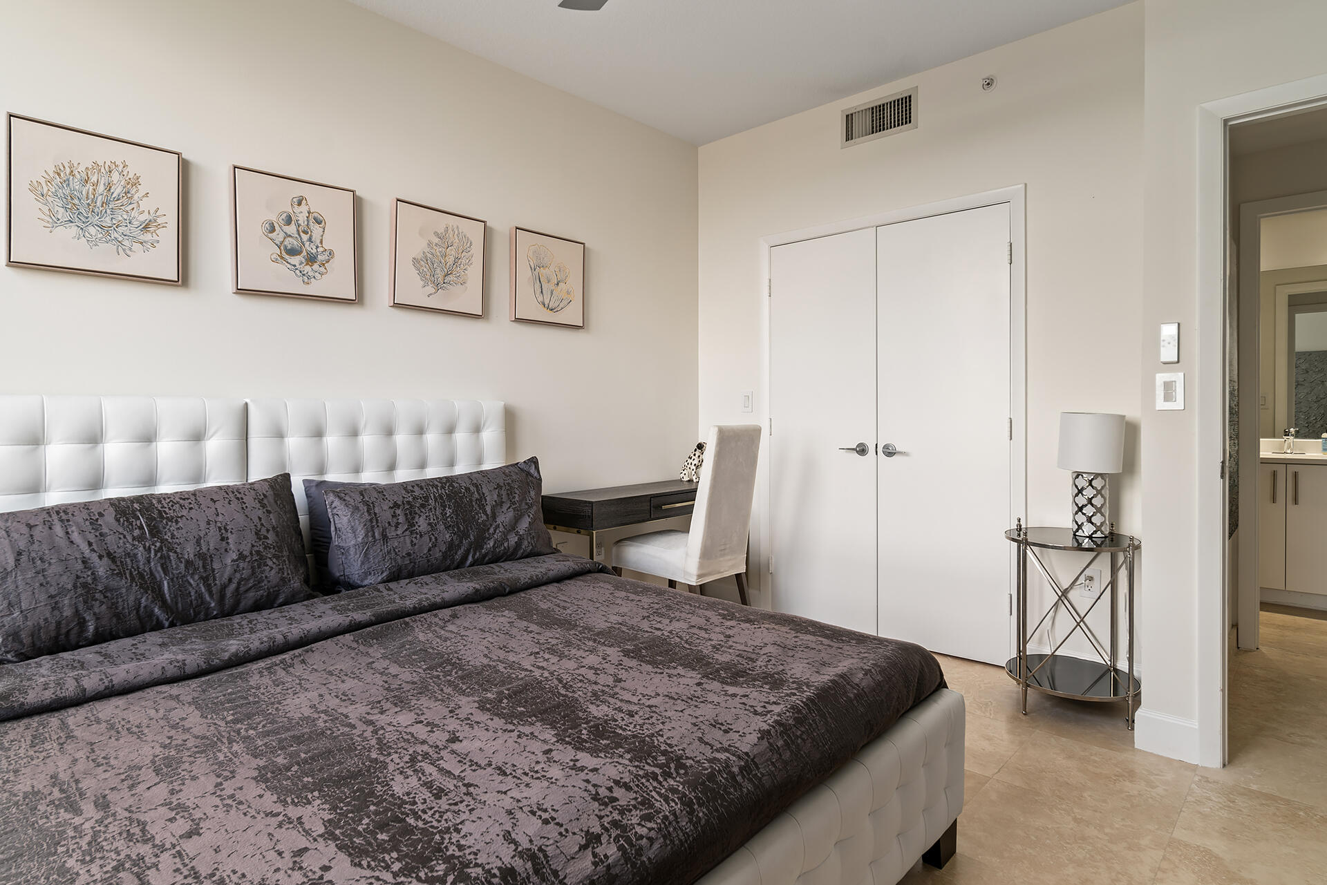 550 Okeechobee Boulevard, Unit 1401 West Palm Beach, FL 33401 - Photo 22 of 46 a living room with a couch