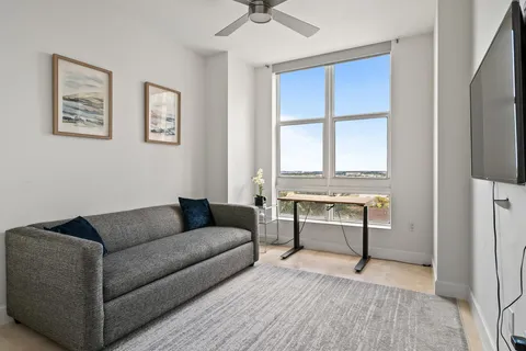 a living room with a couch and a window