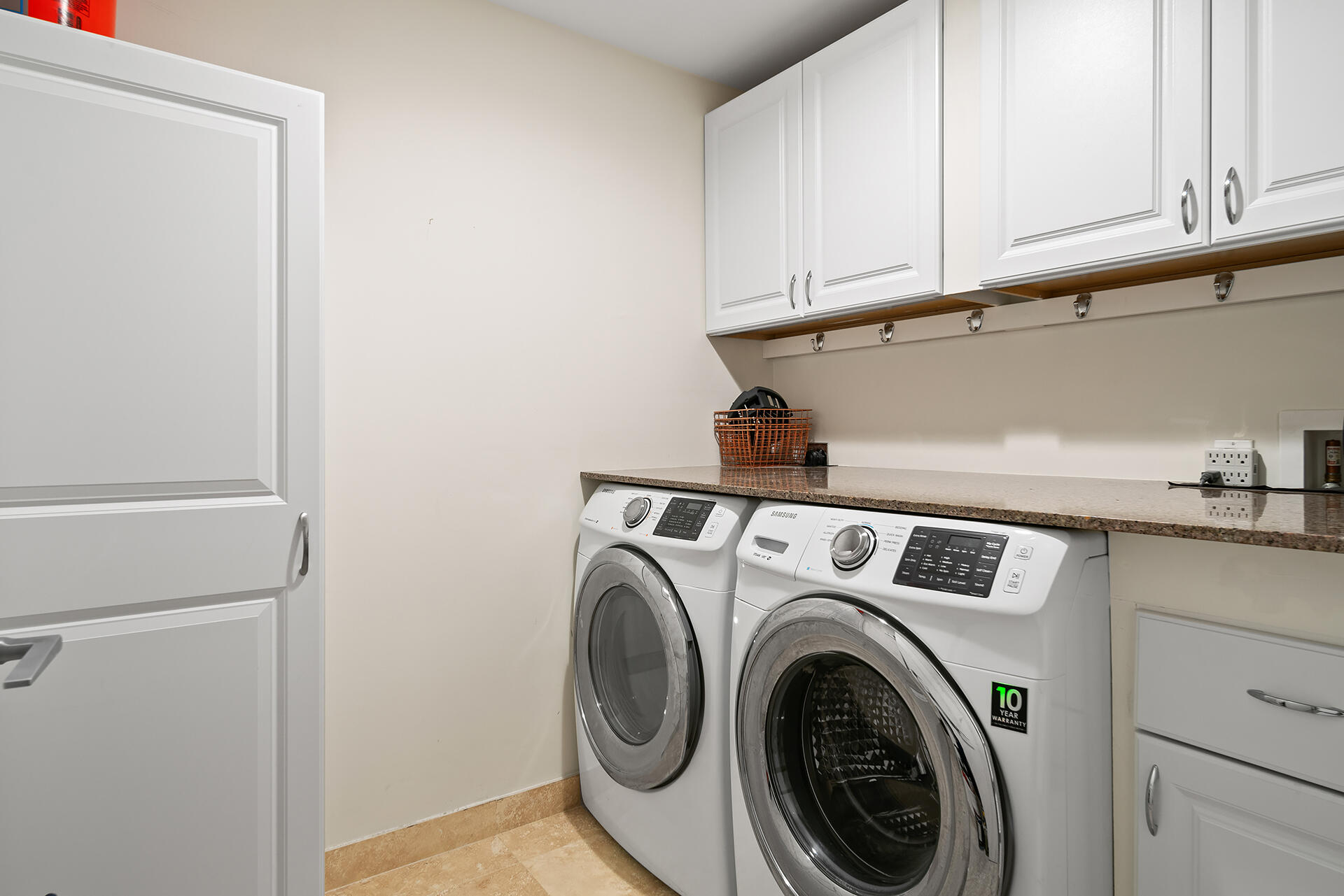 550 Okeechobee Boulevard, Unit 1401 West Palm Beach, FL 33401 - Photo 27 of 46 a utility room with dryer and washer