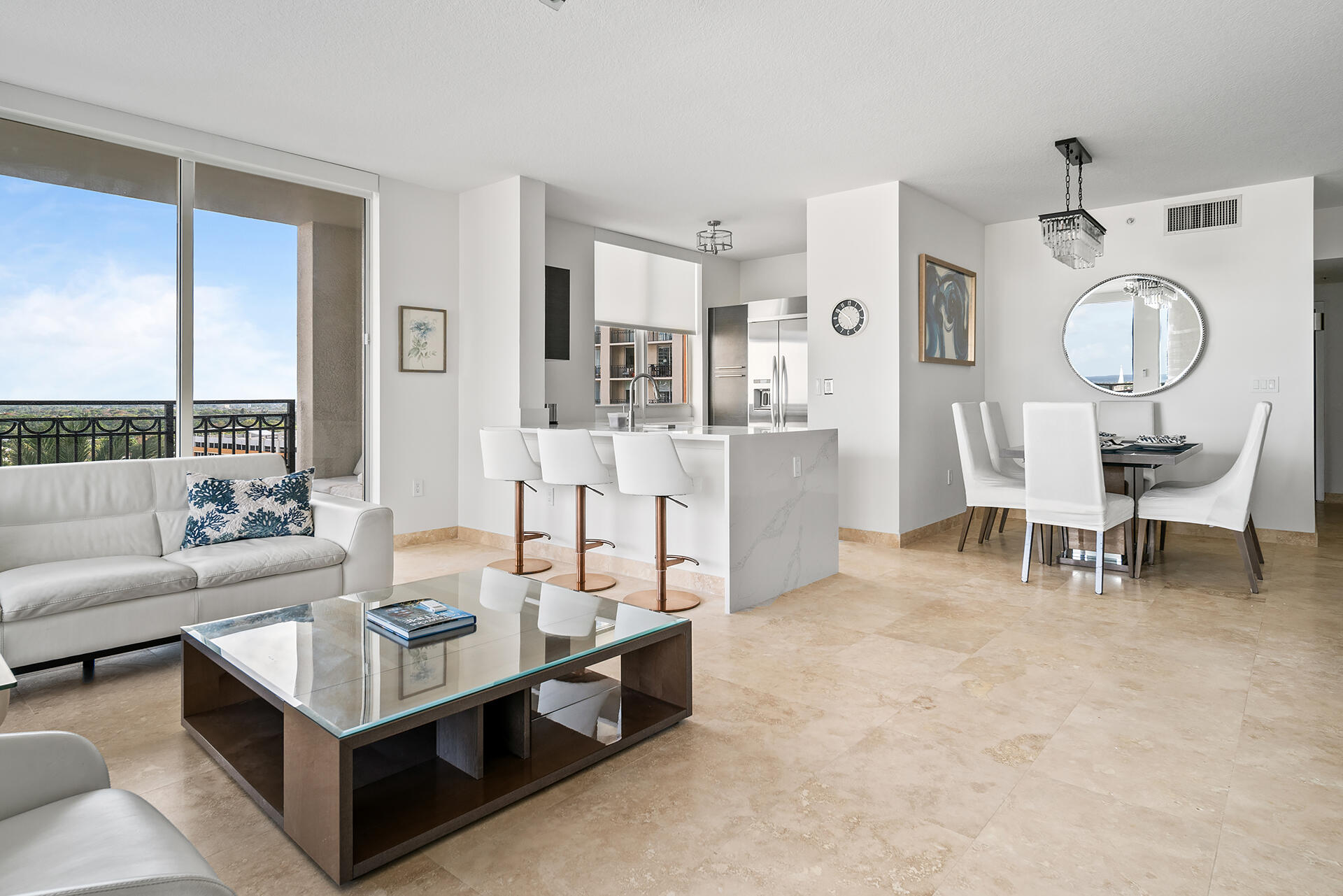 550 Okeechobee Boulevard, Unit 1401 West Palm Beach, FL 33401 - Photo 3 of 46 a living room with furniture and a table