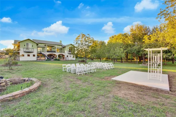 a backyard of a house with lots of green space