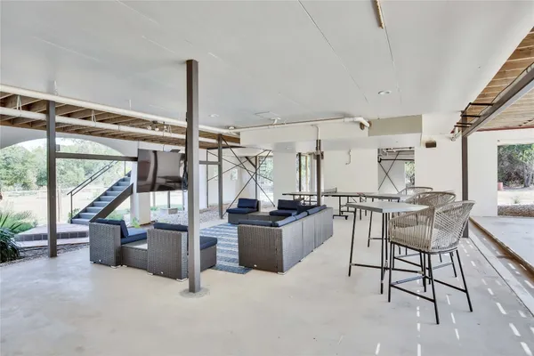 a living room with a table and a window