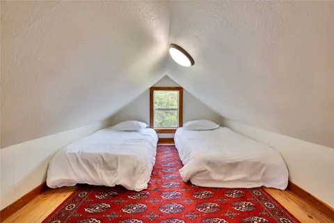 a spacious bedroom with a bed and a couch