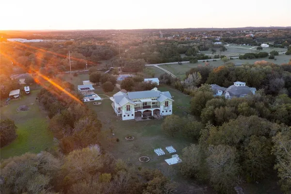 an aerial view of a house with a yard