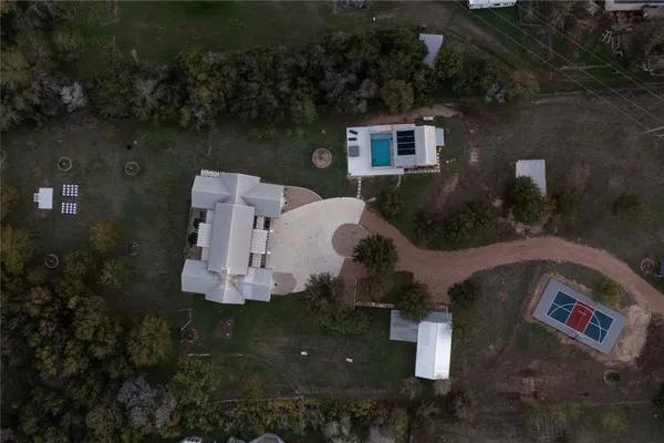 an aerial view of a house with outdoor space and street view