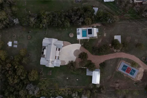 an aerial view of a house with outdoor space and street view