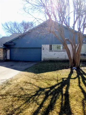 a view of a backyard of the house