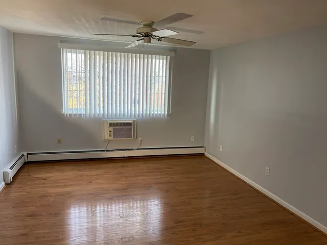 a bathroom with a sink a toilet a shower and a mirror