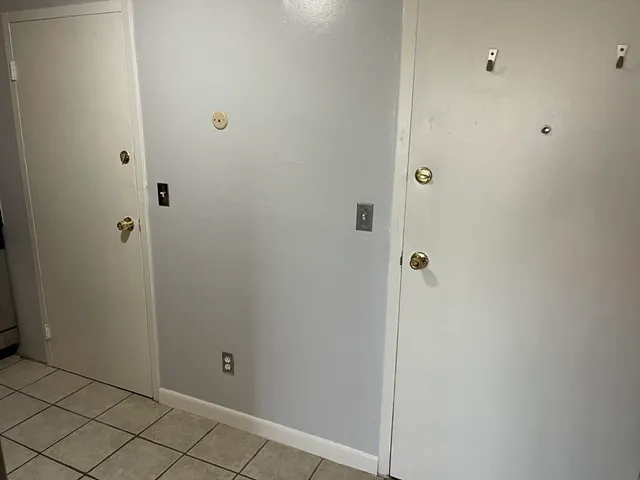 a kitchen with a sink and a refrigerator