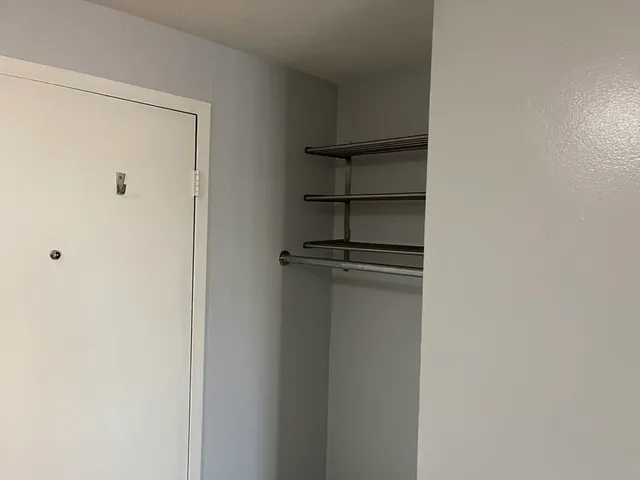 a kitchen with granite countertop a sink stainless steel appliances and cabinets