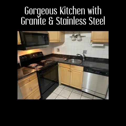 a view of a livingroom with wooden floor and window