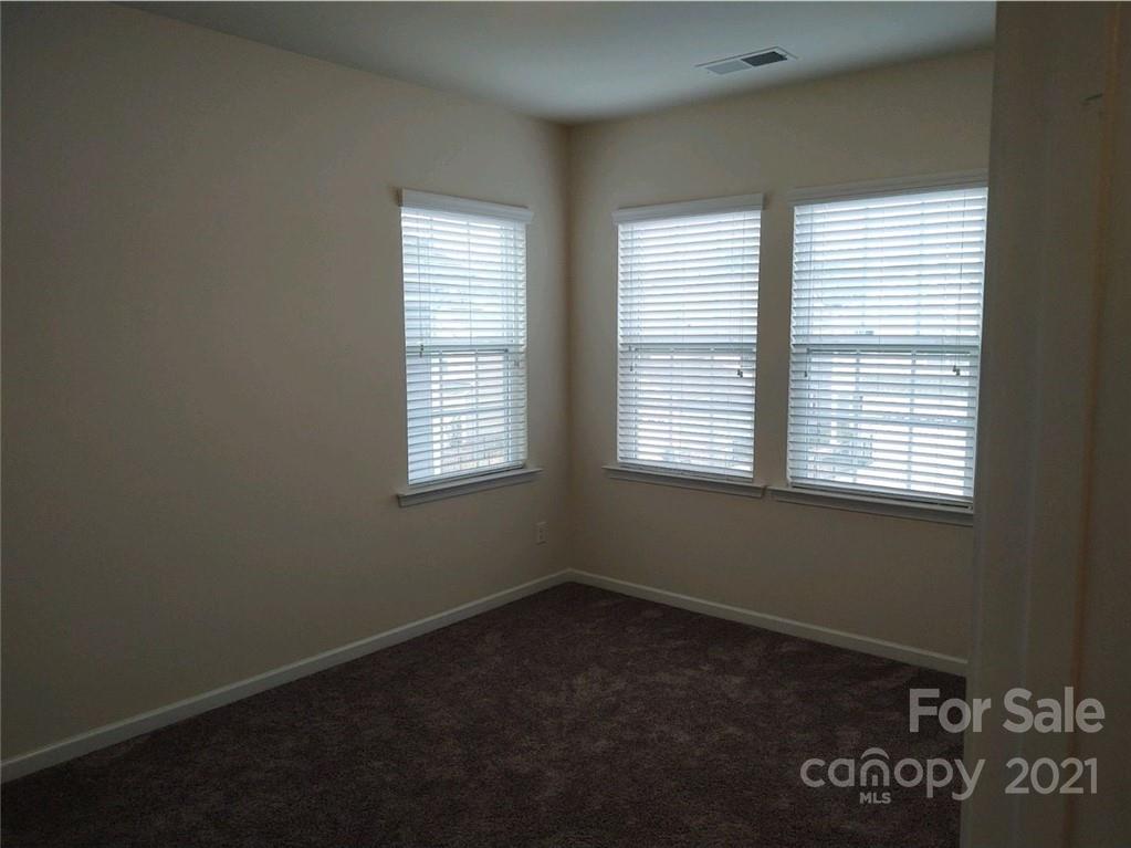 5077 Waterloo Drive Tega Cay, SC 29708 - Photo 10 of 15 an empty room with a window