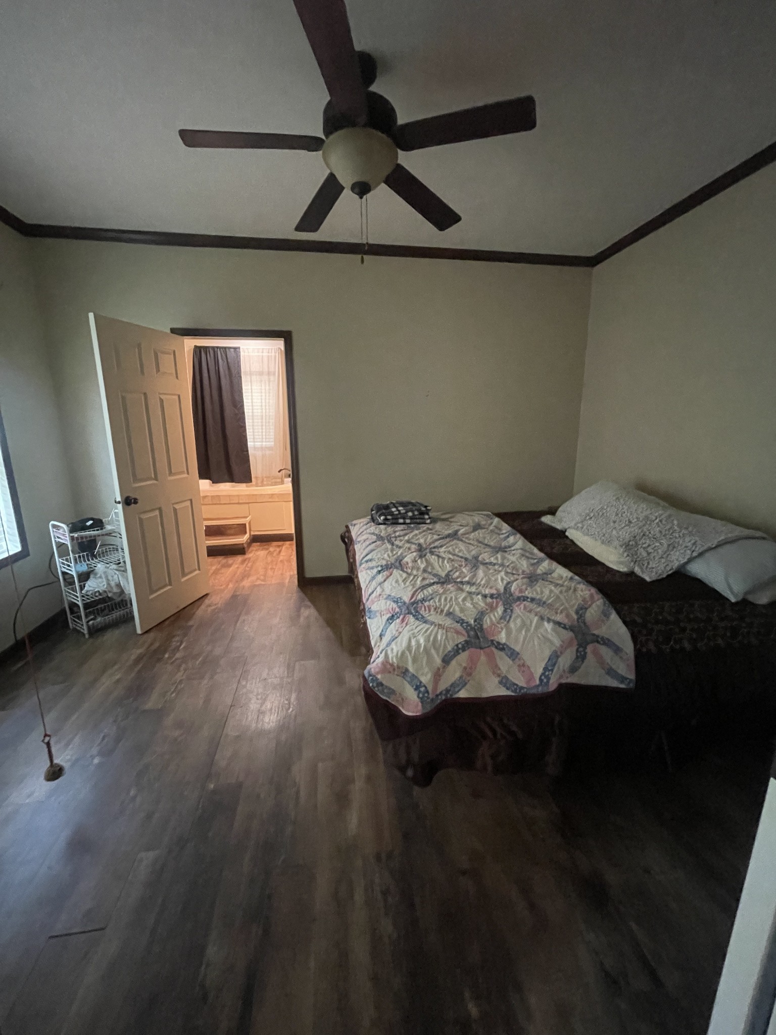 48 Jenkins Village Road Red Boiling Springs, TN 37150 - Photo 6 of 10 a bedroom with a bed and wooden floor