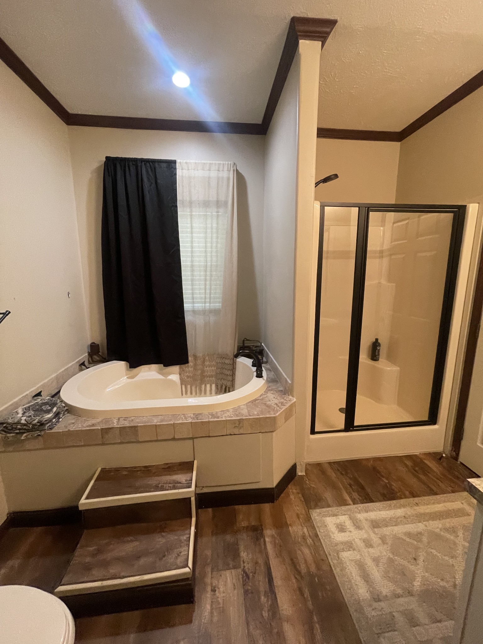 48 Jenkins Village Road Red Boiling Springs, TN 37150 - Photo 8 of 10 a bathroom with a bathtub and a window