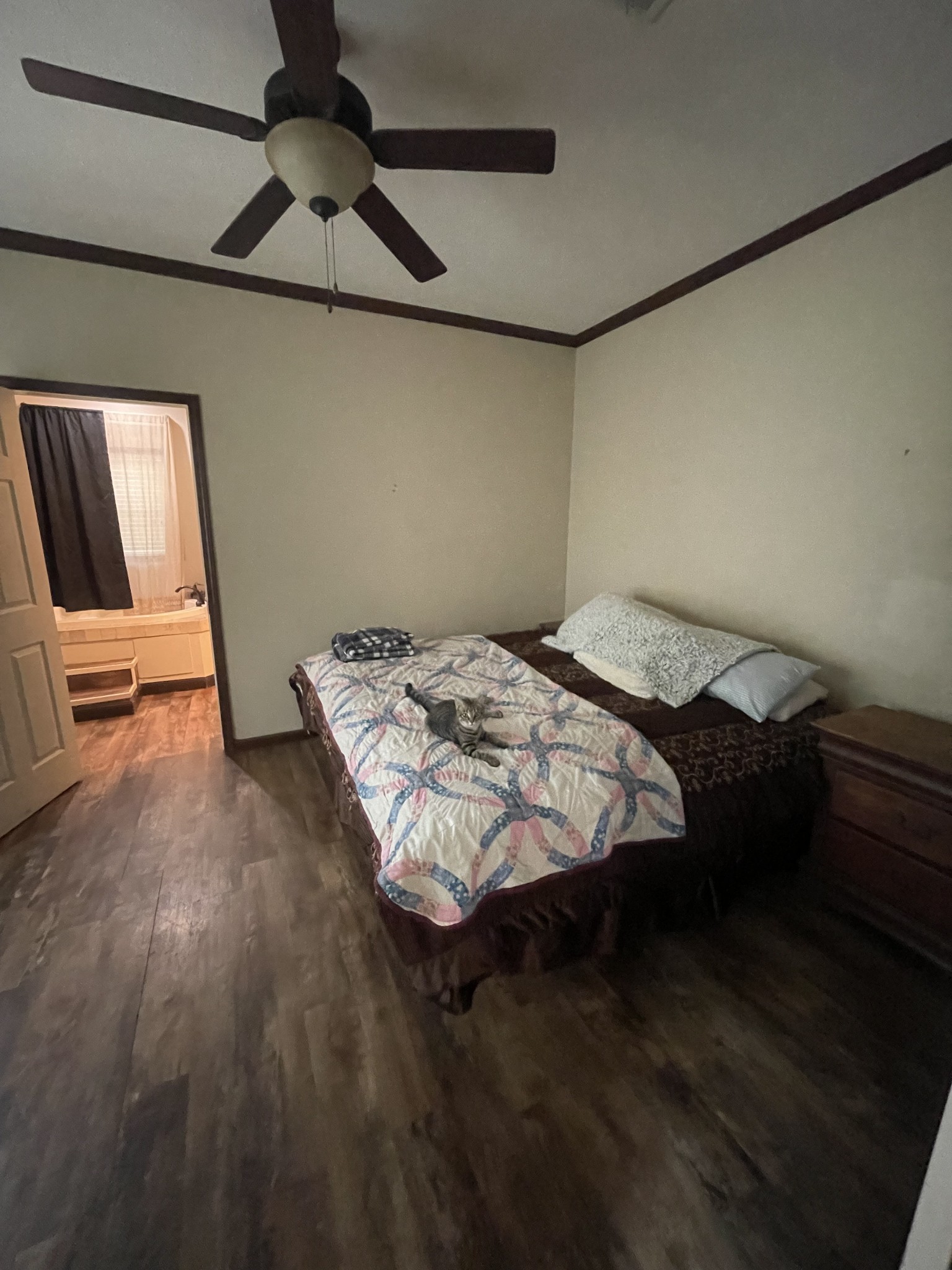 48 Jenkins Village Road Red Boiling Springs, TN 37150 - Photo 9 of 10 a bed sitting in a bedroom next to a window