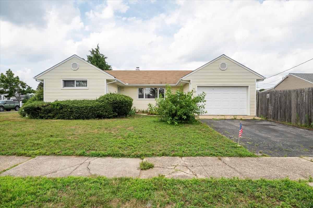 49 Cheshire Road Bethpage, NY 11714 - Photo 1 of 1 Single story home with asphalt driveway and a garage