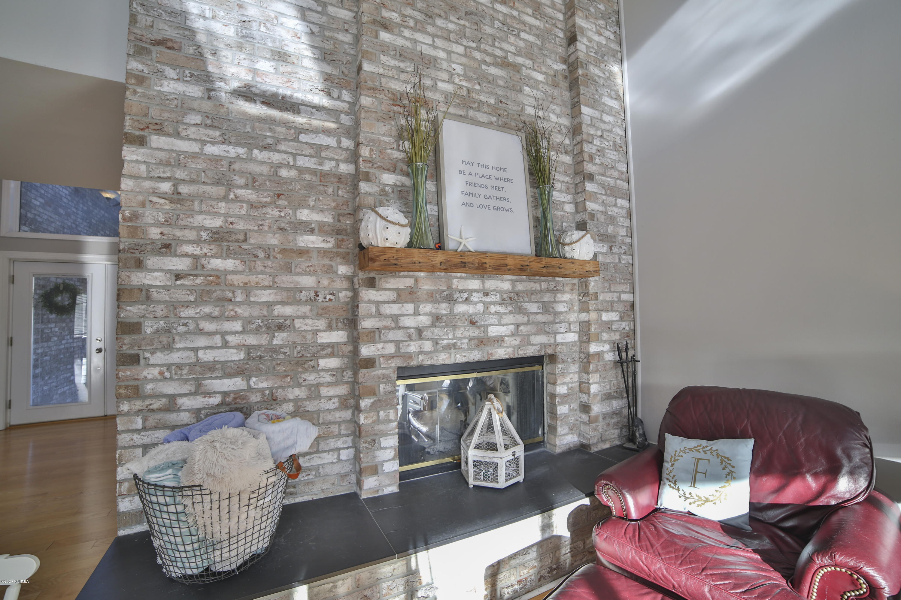 205 Olde Point Loop Hampstead, NC 28443 - Photo 8 of 63 Gorgeous brick fireplace with wood mantle