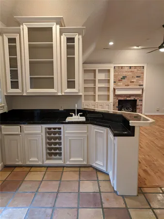 a kitchen with stainless steel appliances a stove a sink and a microwave