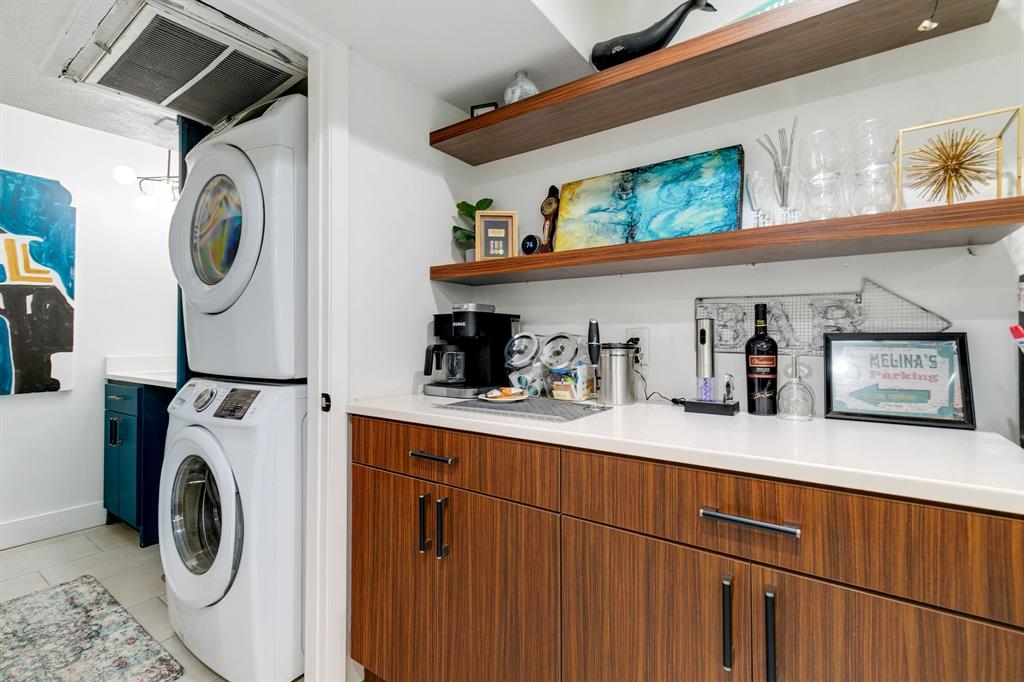 4347 Dickason Avenue, Unit 111 Dallas, TX 75219 - Photo 23 of 37 a utility room with dryer and washer