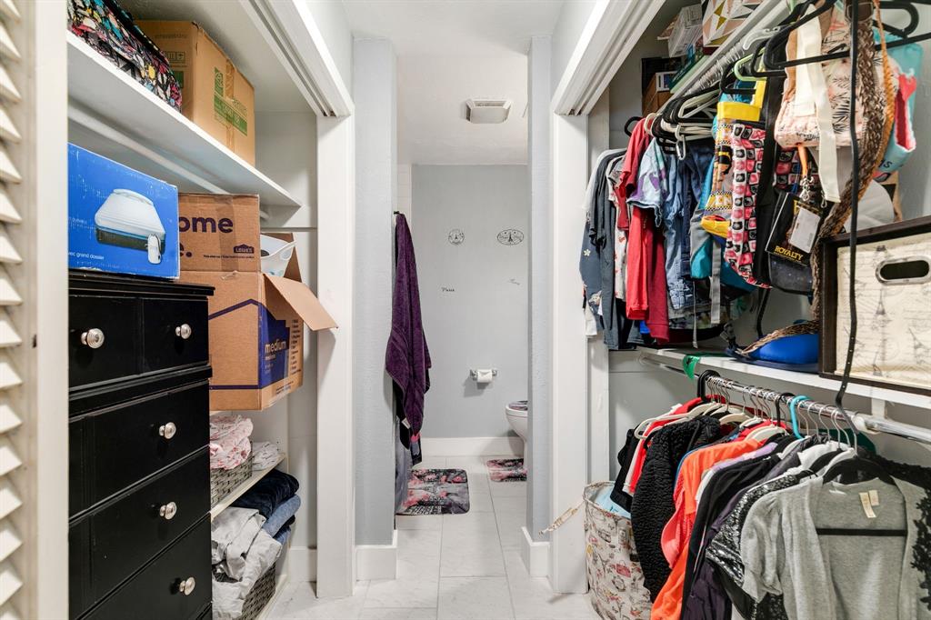 4347 Dickason Avenue, Unit 111 Dallas, TX 75219 - Photo 25 of 37 a view of walk in closet with clothes and shoes