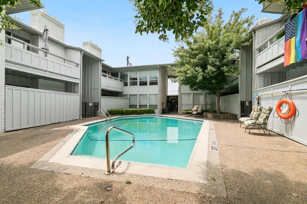 4347 Dickason Avenue, Unit 111 Dallas, TX 75219 - Photo 30 of 37 a view of a swimming pool with a patio